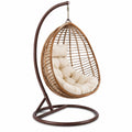Chaise suspendue rotin avec support en métal et coussin beige